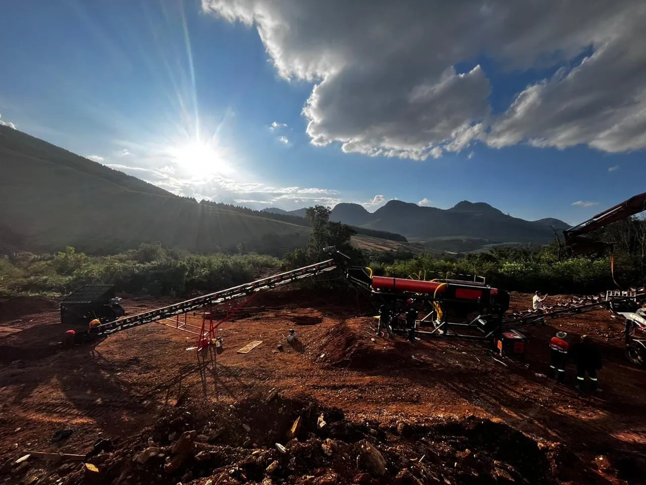 Trommel wash plant and excavator on an alluvial gold site at dusk